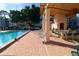 Community pool with a covered picnic area and barbecue grills perfect for outdoor entertaining at 5623 80Th N St # 306, St Petersburg, FL 33709