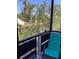 Enjoy the tranquil scenery from this screened balcony, perfect for relaxation and nature viewing at 6080 80Th N St # 409, St Petersburg, FL 33709