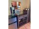 Convenient bar area with a mini-fridge, coffee maker, and storage for glasses and accessories at 6080 80Th N St # 409, St Petersburg, FL 33709