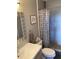 Cozy bathroom featuring a shower with modern tile and decorative shower curtain at 6080 80Th N St # 409, St Petersburg, FL 33709