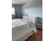 Bedroom with modern furniture and hardwood floors at 6080 80Th N St # 409, St Petersburg, FL 33709