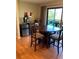 Dining area features a round table with access to the balcony, complemented by a stylish bar area at 6080 80Th N St # 409, St Petersburg, FL 33709