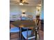 Cozy dining area features a round table with seating for four, seamlessly connected to the living space at 6080 80Th N St # 409, St Petersburg, FL 33709