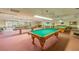 Spacious game room with multiple billiard tables and overhead lighting at 6080 80Th N St # 409, St Petersburg, FL 33709