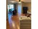 View of living room with dining area and sliding glass doors leading to the outside at 6080 80Th N St # 409, St Petersburg, FL 33709