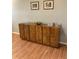 Close up of built-in cabinet and console table with glass display at 6080 80Th N St # 409, St Petersburg, FL 33709