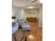Living room with stylish armchair and ottoman plus wood cabinet at 6080 80Th N St # 409, St Petersburg, FL 33709