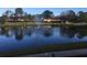 Scenic view of a tranquil pond with a fountain and lush greenery, creating a peaceful community setting at 6080 80Th N St # 409, St Petersburg, FL 33709