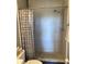 Tiled shower with a showerhead and a decorative shower curtain at 6080 80Th N St # 409, St Petersburg, FL 33709