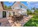 Outdoor brick patio with dining table and seating, ideal for entertaining and relaxation at 6213 12Th S Ave, Gulfport, FL 33707