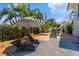 Relaxing backyard featuring lounge chairs, a hammock, and lush tropical landscaping at 6213 12Th S Ave, Gulfport, FL 33707