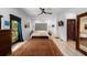 Bright bedroom featuring wood-look flooring and large area rug at 6213 12Th S Ave, Gulfport, FL 33707