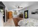 Bright bedroom with light floors, a ceiling fan, and a decorative area rug at 6213 12Th S Ave, Gulfport, FL 33707