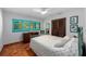 Bright bedroom featuring light and airy decor, turquoise window frames and unique floors at 6213 12Th S Ave, Gulfport, FL 33707
