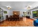 Elegant dining room with traditional furniture, terra cotta tile floors, and stylish lighting fixtures at 6213 12Th S Ave, Gulfport, FL 33707