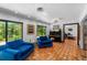 Bright living room featuring cozy seating, large windows and terra cotta tile floors at 6213 12Th S Ave, Gulfport, FL 33707