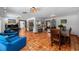 Open concept living space with terra cotta tile flooring and stainless steel appliances at 6213 12Th S Ave, Gulfport, FL 33707