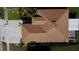 Aerial of house showing roof, enclosed porch, landscaping, and nearby neighborhood streets at 6446 Louisiana Ave, New Port Richey, FL 34653