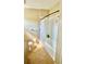Bathroom featuring shower-tub combo with a shower curtain and tile flooring at 6446 Louisiana Ave, New Port Richey, FL 34653