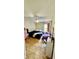 Bedroom with new hard wood flooring, ceiling fan, and large window at 6446 Louisiana Ave, New Port Richey, FL 34653