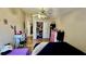 Bedroom featuring hardwood flooring, ceiling fan, and a spacious closet at 6446 Louisiana Ave, New Port Richey, FL 34653