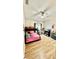 Bright bedroom with bunk beds, ceiling fan, and wood-look flooring at 6446 Louisiana Ave, New Port Richey, FL 34653
