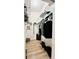 Walk in closet with wire shelving and laminate wood flooring at 6446 Louisiana Ave, New Port Richey, FL 34653