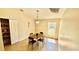 Dining room with tile floor, small table and chairs, and overhead light fixture at 6446 Louisiana Ave, New Port Richey, FL 34653