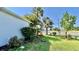 Well-maintained front yard with attractive landscaping, shrubs, and a view of the street at 6446 Louisiana Ave, New Port Richey, FL 34653