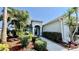 Beautiful landscaped front yard featuring lush greenery and a well-maintained walkway to the entrance at 6446 Louisiana Ave, New Port Richey, FL 34653