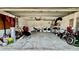 Spacious two car garage with washer and dryer, storage, and concrete flooring at 6446 Louisiana Ave, New Port Richey, FL 34653