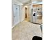 Spacious kitchen with stainless steel refrigerator and tile flooring at 6446 Louisiana Ave, New Port Richey, FL 34653
