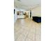 Open-concept living space with tile floors and easy access to the kitchen area at 6446 Louisiana Ave, New Port Richey, FL 34653