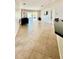 Spacious living room with tile flooring and sliding glass doors to the backyard at 6446 Louisiana Ave, New Port Richey, FL 34653