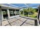 Covered patio area with tiled flooring and views to the backyard at 6446 Louisiana Ave, New Port Richey, FL 34653