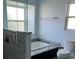 Bright bathroom with a soaking tub, separate shower, and a white toilet at 7033 123Rd St, Seminole, FL 33772