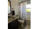 Bathroom featuring a vanity, toilet, and shower/tub with shower curtain at 7033 123Rd St, Seminole, FL 33772
