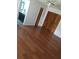 Bedroom boasts hardwood flooring, closet, and ensuite bathroom with sleek black cabinetry at 7033 123Rd St, Seminole, FL 33772