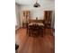 Dining room with hardwood floors features matching furniture and two display cabinets at 7033 123Rd St, Seminole, FL 33772