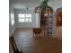 Dining room with decorative lighting, windows, and a partial view of the living room and fireplace at 7033 123Rd St, Seminole, FL 33772