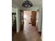 Welcoming entryway features decorative lighting, tile flooring, and glass paneled french doors at 7033 123Rd St, Seminole, FL 33772