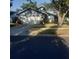 Charming single-story home with a two-car garage and mature landscaping in a peaceful neighborhood setting at 7033 123Rd St, Seminole, FL 33772