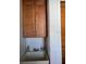 Functional laundry room features overhead cabinets for storage at 7033 123Rd St, Seminole, FL 33772