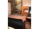 Cozy living room featuring stone fireplace and a wooden entertainment center on a tiled floor at 7033 123Rd St, Seminole, FL 33772