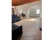 An open floor plan living room area with tile floors and comfortable seating at 7033 123Rd St, Seminole, FL 33772