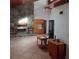 Spacious living room featuring stone fireplace and a wooden entertainment center on a tiled floor at 7033 123Rd St, Seminole, FL 33772