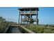 Wooden observation tower surrounded by lush greenery and a winding boardwalk at 7033 123Rd St, Seminole, FL 33772