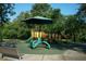 Neighborhood playground with shade umbrellas and multiple play structures at 7033 123Rd St, Seminole, FL 33772