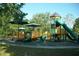 Colorful playground with slides, climbing structures, and shaded picnic areas at 7033 123Rd St, Seminole, FL 33772