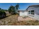 Backyard featuring a detached building and patio space at 7420 Cay Dr, Port Richey, FL 34668